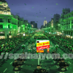 مشهد جوي لمسيرة يوم القديس باتريك في شارع جران فيا بمدريد حيث تكتسي المباني والشوارع باللون الأخضر.