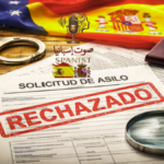 Rejected Spanish asylum application with documents, passport, handcuffs, and blurred Spanish and EU flags in the background.